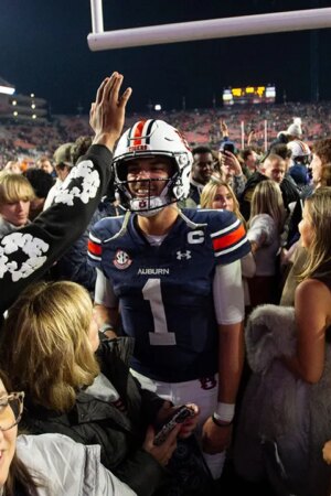 Unranked Auburn upsets CFP-hopeful Texas A&M in 4 OT thriller after game-tying score is dropped