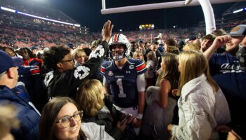 Unranked Auburn upsets CFP-hopeful Texas A&M in 4 OT thriller after game-tying score is dropped