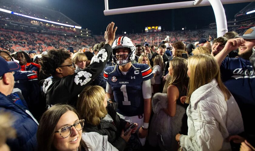 Unranked Auburn upsets CFP-hopeful Texas A&M in 4 OT thriller after game-tying score is dropped