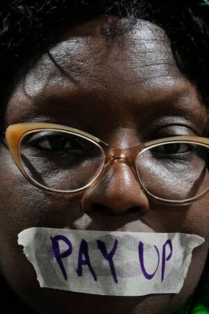 An activist during a demonstration for climate finance at the COP29. Pic: AP