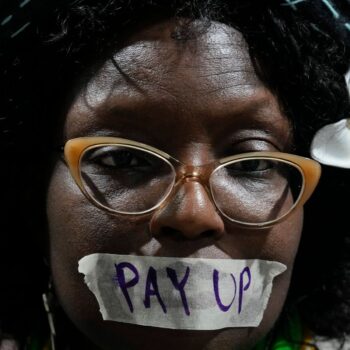 An activist during a demonstration for climate finance at the COP29. Pic: AP