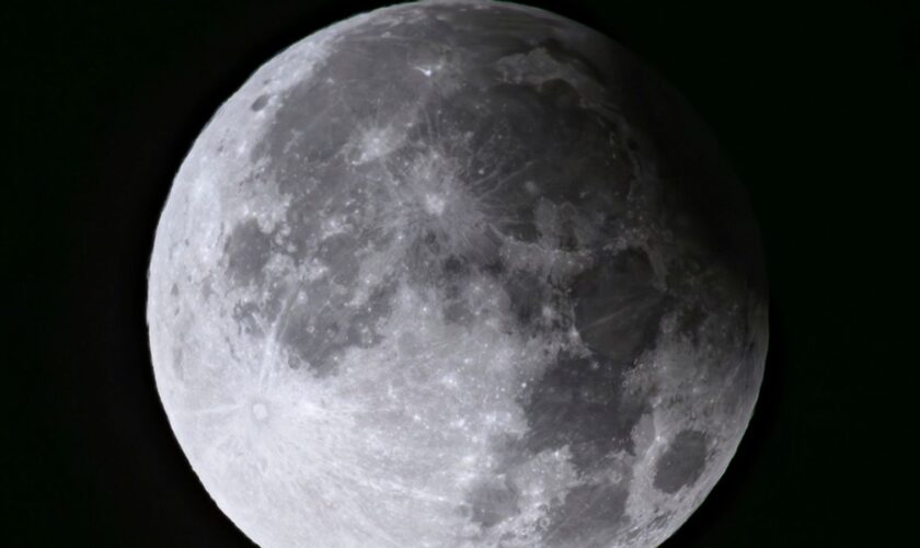 A supermoon with a partial solar eclipse rises over Brandenburg, Biegen, Germany. Pic: AP