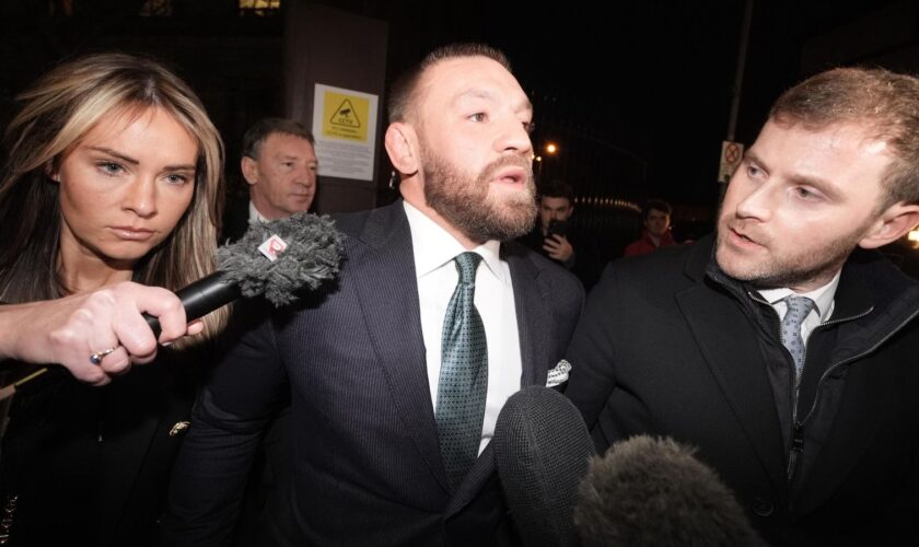 Mixed martial arts fighter Conor McGregor (centre) and partner Dee Devlin leave the High Court in Dublin after the personal injury case against him. Nikita Hand, who is also known as Nikita Ni Laimhin, alleges she was raped by McGregor in a Dublin hotel in December 2018. After deliberating for six hours and 10 minutes, the jury returned with their verdicts in the civil trial against Conor McGregor. The total amount of damages awarded to Nikita Hand by the jury was 248,603.60 euro. Picture date: Friday November 22, 2024. PA Photo. See PA story IRISH McGregor. Photo credit should read: Brian Lawless/PA Wire