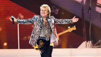 Rod Stewart gestures onstage at the Royal Arena during his "One Last Time" concert in Copenhagen, on Sunday, June 9, 2024. (Torben Christensen/Ritzau Scanpix via AP)