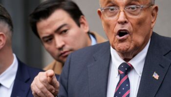 Rudy Giuliani speaks to reporters as he leaves the federal courthouse in New York, Tuesday, Nov. 26, 2024. (AP Photo/Seth Wenig)