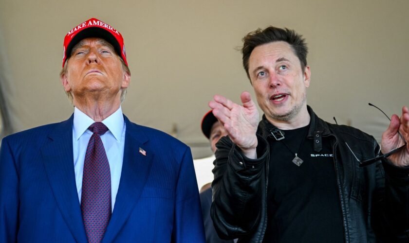 Elon Musk speaks with U.S. President-elect Donald Trump as they watch the launch of the sixth test flight of the SpaceX Starship rocket in Brownsville, Texas, U.S., November 19, 2024. Brandon Bell/Pool via REUTERS