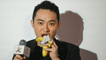 Chinese-born crypto founder Justin Sun eats a banana artwork. Pic: Peter Parks/AFP/Getty