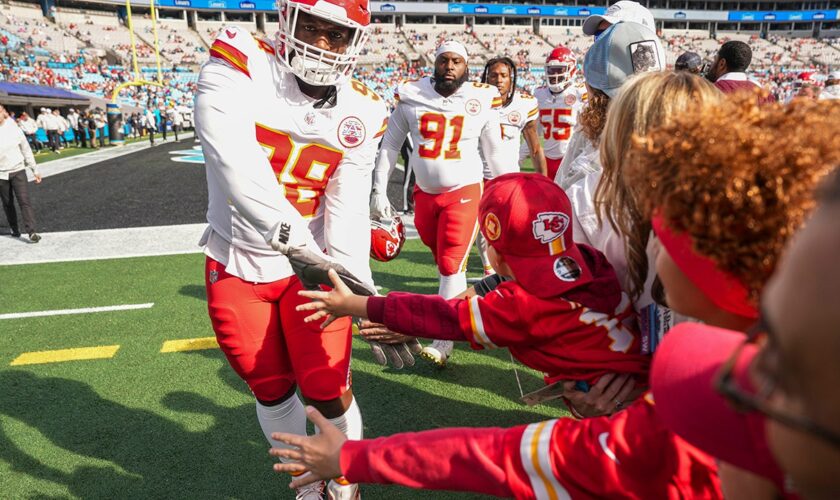 Chiefs lineman Tershawn Wharton catches young fan after falling over barrier at Panthers' stadium