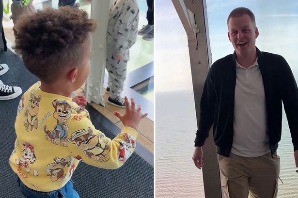 Adorable moment toddler 'tries to save' dad from falling through glass walkway