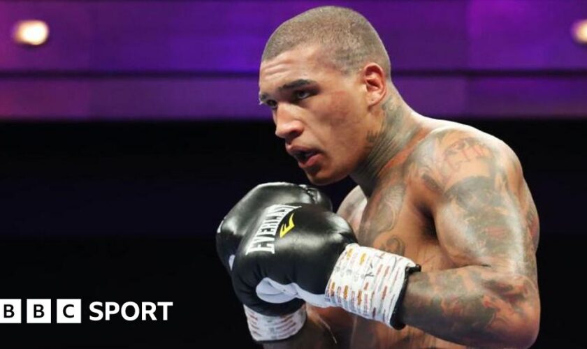 Conor Benn in black gloves during a fight