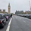 Black cabs line the streets of London on Remembrance Sunday to give free lifts to veterans who dutifully fought for our freedom when it mattered most