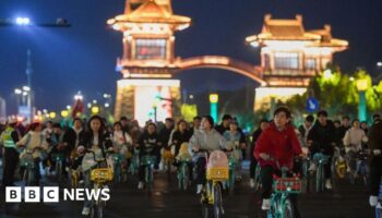 China roads blocked by thousands of cyclists in night quest for dumplings