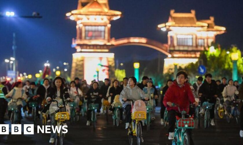 China roads blocked by thousands of cyclists in night quest for dumplings