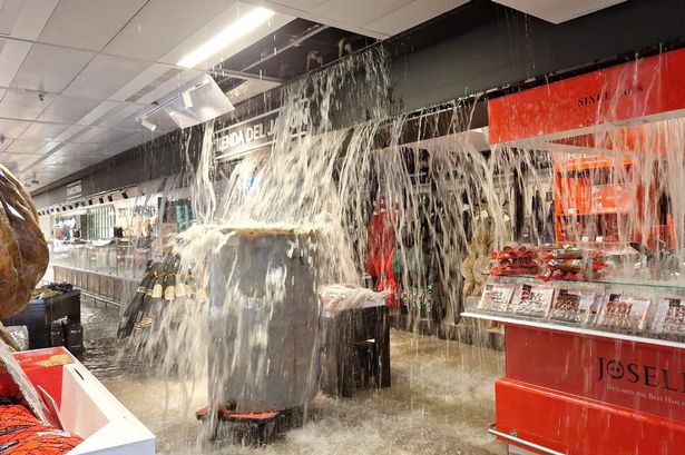 Costa del Sol floods: Rain gushes out of shop ceiling as Spain put on red alert