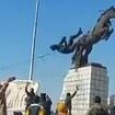 Dramatic moment Islamist rebels topple statue of Bashar Al Assad's brother as they storm Aleppo in Syrian president's biggest crisis yet - as Putin's forces hit back with airstrikes to help embattled regime