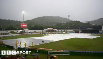 Covers on the pitch during a rain delay at the Daren Sammy cricket ground in St Lucia