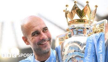 Pep Guardiola with the Premier League trophy