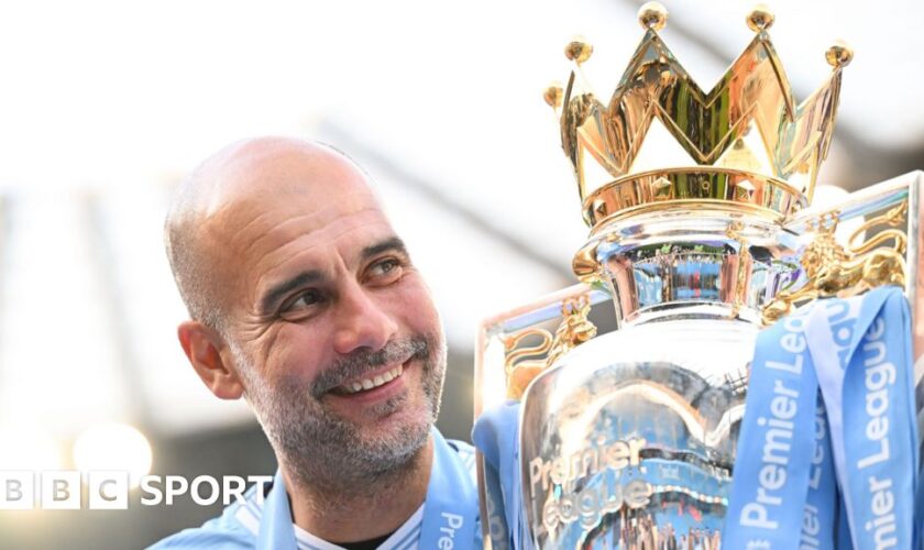 Pep Guardiola with the Premier League trophy