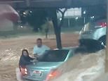 Harrowing video shows influencer and husband clinging on to their car in raging floods before she was swept away to her death - minutes after haunting final social media post