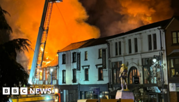 Houses evacuated after huge town centre fire