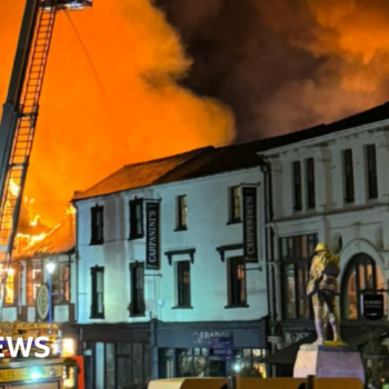 Houses evacuated after huge town centre fire