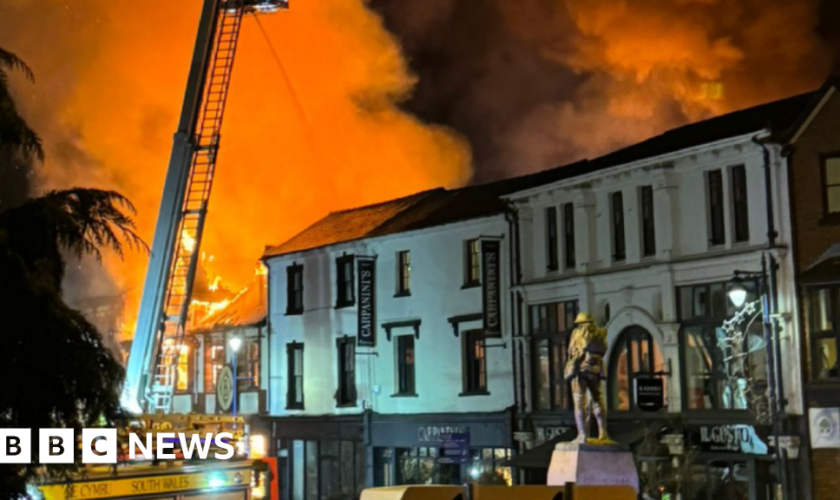 Houses evacuated after huge town centre fire