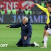 Fenerbahce boss Jose Mourinho tries to do a knee slide after his side's win at Trabzonspor