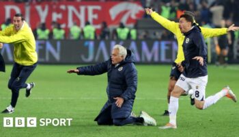 Fenerbahce boss Jose Mourinho tries to do a knee slide after his side's win at Trabzonspor