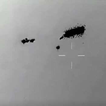 Jaw-dropping video shows swarm of UFOs 'completely unaffected' by missile attack