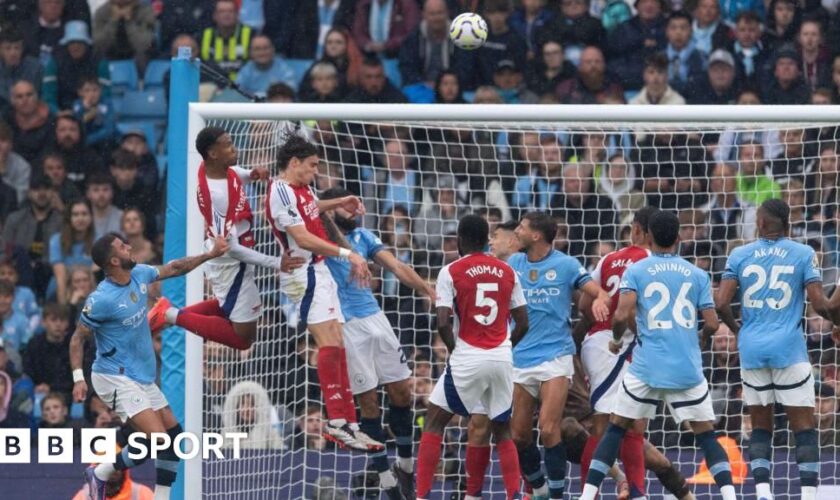 Arsenal score from a corner against Manchester City.