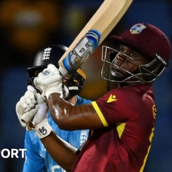 Evin Lewis hits a boundary against England