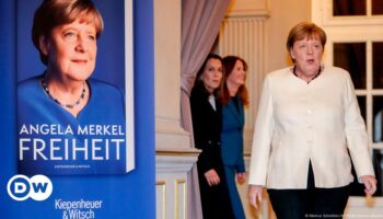 Merkel defends controversial decisions at book launch