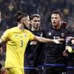 Nations League clash ABANDONED following on-pitch brawl - as one team walks off in protest in the last MINUTE after 'taking offence' from fan chants