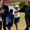 Prince William shows off his rugby skills and is tackled by Springbok legend Joel Stranksy during visit to South African township