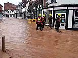 Shocking moment floodwaters gush down streets of market town as emergency service crews urge locals to 'get back': Death toll for Storm Bert rises to four 