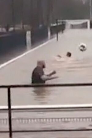 Storm Bert: Football team swims in flooded pitch