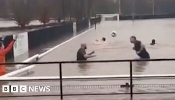 Storm Bert: Football team swims in flooded pitch