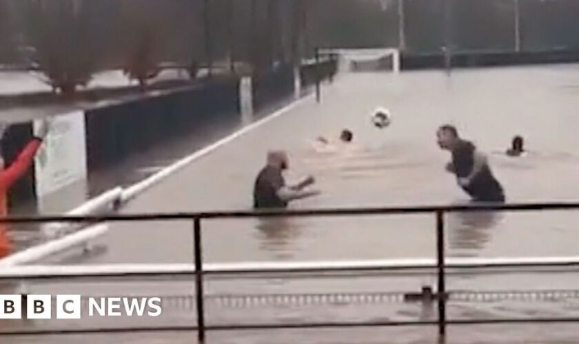 Storm Bert: Football team swims in flooded pitch