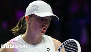 Iga Swiatek reacts during a match at the 2024 WTA Finals