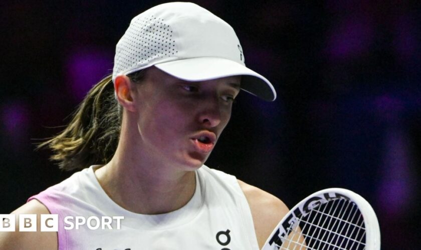 Iga Swiatek reacts during a match at the 2024 WTA Finals