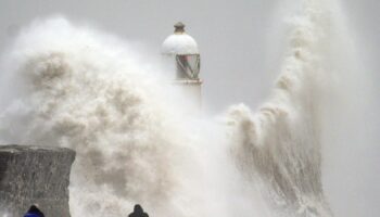 Waves crash over the seafront in Porthcawl in Wales. Millions have been warned to stay indoors, thousands are without power and trains have been cancelled as the Government's "risk to life" alert brought on by Storm Darragh came into force. Picture date: Saturday December 7, 2024. PA Photo. Photo credit should read: Ben Birchall/PA Wire