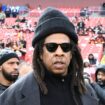 Musician Jay-Z stands on the field before an NFL football game between the Washington Commanders and Dallas Cowboys, Sunday, Nov. 24, 2024, in Landover, Md. (AP Photo/Nick Wass)