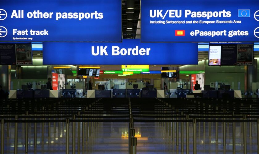 UK Border control is seen in Terminal 2 at Heathrow Airport in London June 4, 2014. REUTERS/Neil Hall