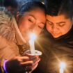 Supporters hold candles during a candlelight vigil Tuesday, Dec. 17, 2024, outside the Wisconsin Capitol in Madison, Wis., following a shooting at the Abundant Life Christian School on Monday, Dec. 16. (AP Photo/Morry Gash)