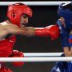 Imran Khelife, left, during her gold medal winning bout. Pic: Reuters