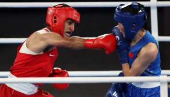 Imran Khelife, left, during her gold medal winning bout. Pic: Reuters