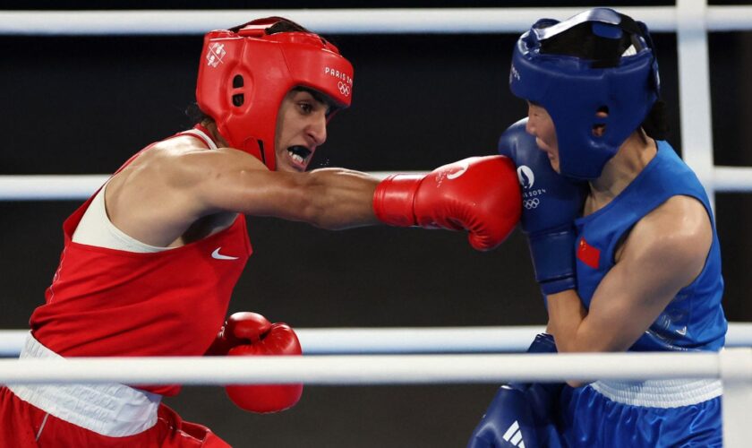 Imran Khelife, left, during her gold medal winning bout. Pic: Reuters