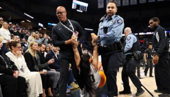 Security guards tackle two women to the ground during Knicks-Timberwolves game after they ran onto court