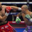 Boxers Britain's Tyson Fury, left, and Ukraine's Oleksandr Usyk compete during their WBA, WBO, and WBC world heavyweight title fight in Riyadh, Saudi Arabia, Saturday, Dec. 21, 2024. (AP Photo/Frank Augstein)