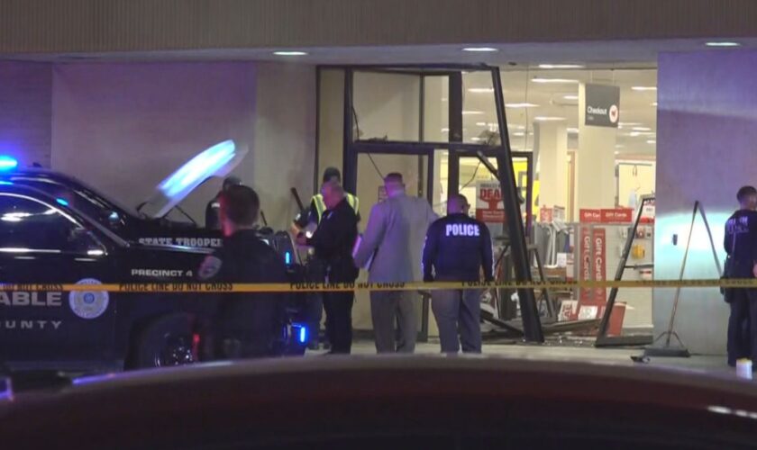 This image taken from video provided by KCEN-TV shows police responding after a man drove a vehicle into a JCPenney at a shopping mall Saturday, Dec. 21, 2024, in Killeen, Texas. (KCEN-TV via AP)